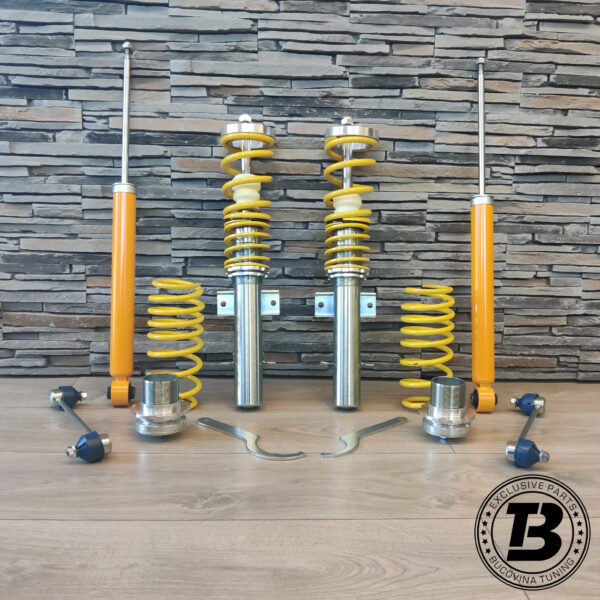 Kit suspensie sport reglabilă FK compatibil cu VW Polo 9N, cu amortizoare, arcuri, suporturi și chei, pe fundal de piatră