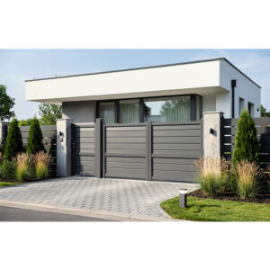 Porți Baldur în varianta gri antracit, la o casă modernă albă cu acoperiș plat și alee pavată